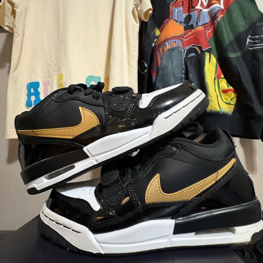 Kids Black and Gold Jordan Sneakers